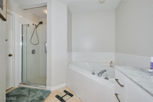 bathroom featuring tile patterned flooring, vanity, and plus walk in shower