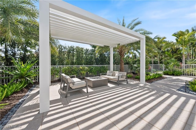 view of patio / terrace with fence, a pergola, and an outdoor living space with a fire pit