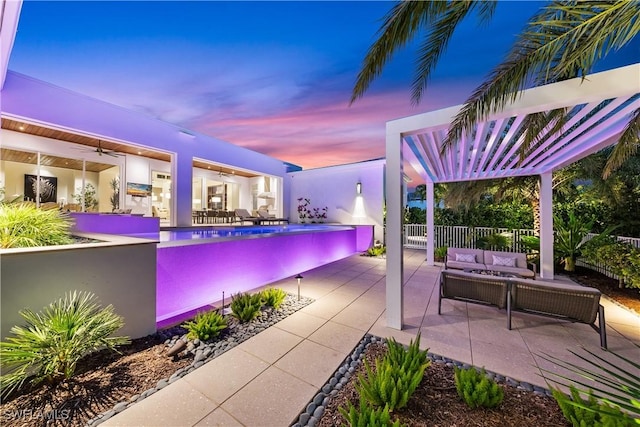 view of swimming pool featuring ceiling fan, an outdoor hangout area, fence, a patio area, and a pergola