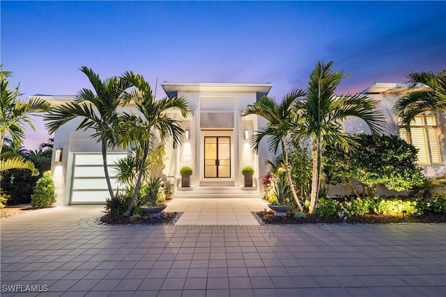4220 Crayton Rd, Naples, FL 34103 - view of front facade featuring stucco siding and curved driveway
