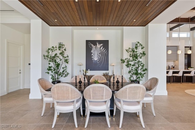 4220 Crayton Rd, Naples, FL 34103 - dining space with tile patterned floors and wooden ceiling