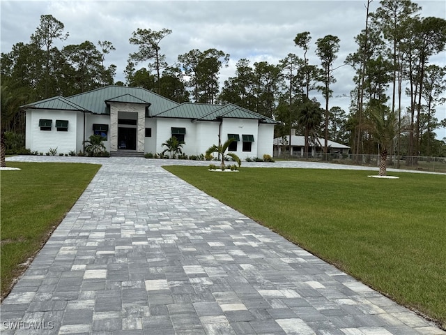 modern farmhouse style home featuring a front lawn