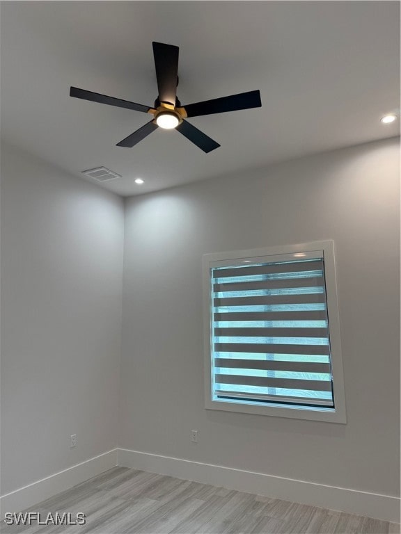 unfurnished room with ceiling fan and light hardwood / wood-style floors