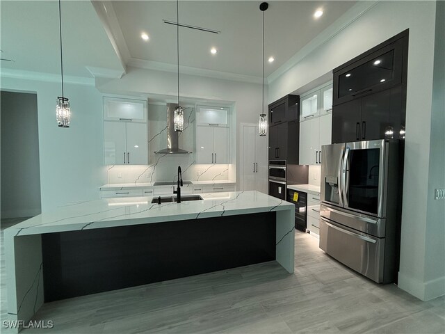 bathroom featuring vanity, hardwood / wood-style floors, backsplash, and ornamental molding