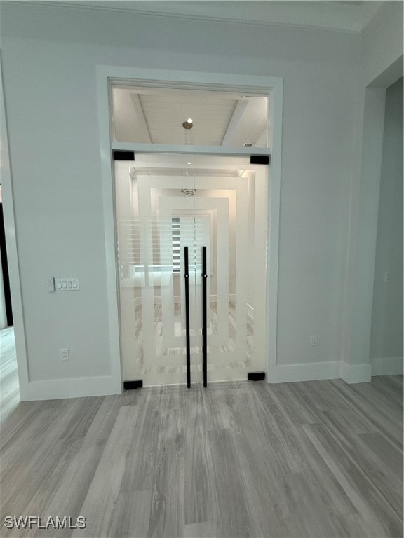 unfurnished room with light hardwood / wood-style flooring