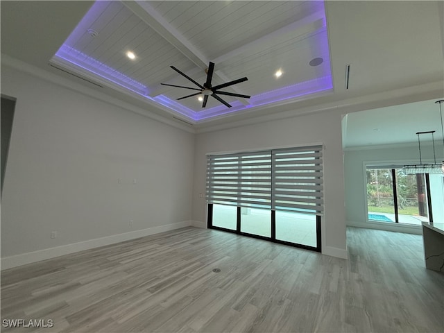 spare room with wooden ceiling, crown molding, ceiling fan, light wood-type flooring, and beamed ceiling