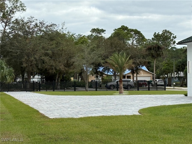 view of home's community with a lawn