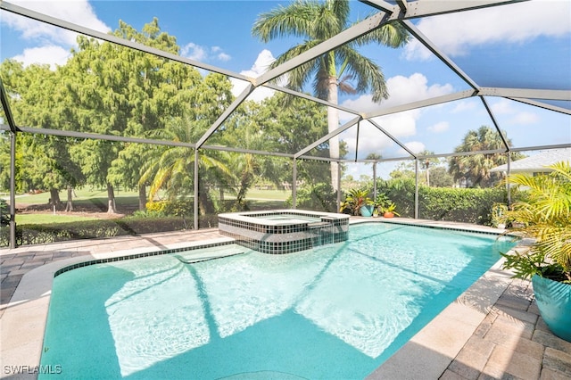 view of pool with a lanai and an in ground hot tub