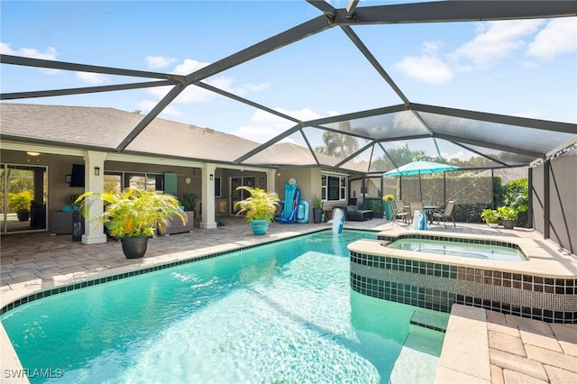 view of pool featuring a lanai, a patio area, and an in ground hot tub