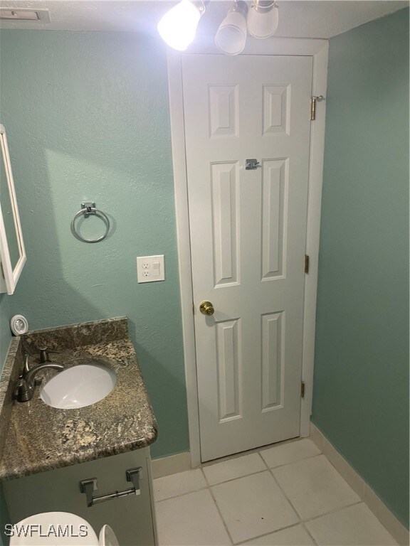 bathroom featuring vanity and tile patterned flooring