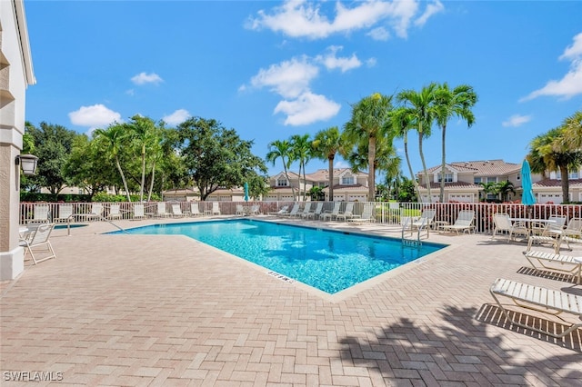 view of swimming pool with a patio area