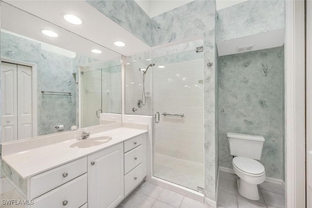 bathroom featuring vanity, toilet, walk in shower, and tile patterned floors