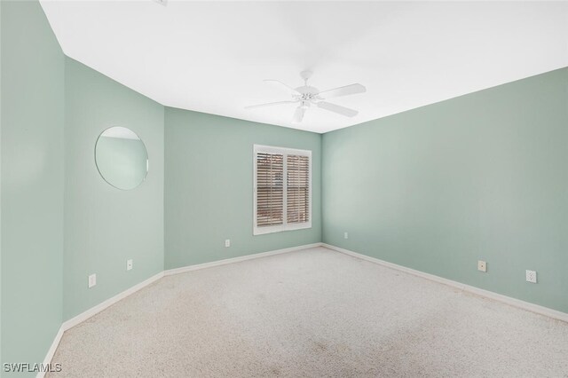 empty room with carpet flooring and ceiling fan