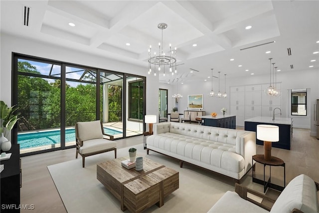 living room featuring recessed lighting, coffered ceiling, a notable chandelier, and beamed ceiling