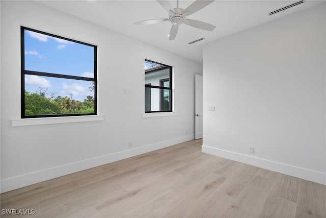 unfurnished room featuring light wood-type flooring and ceiling fan