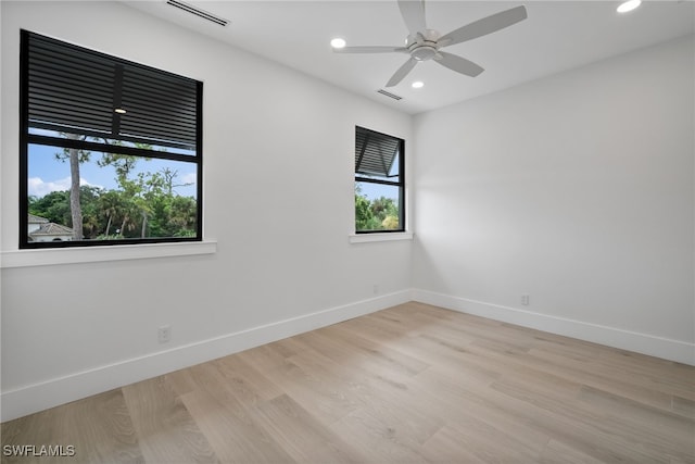 spare room with ceiling fan and light hardwood / wood-style floors