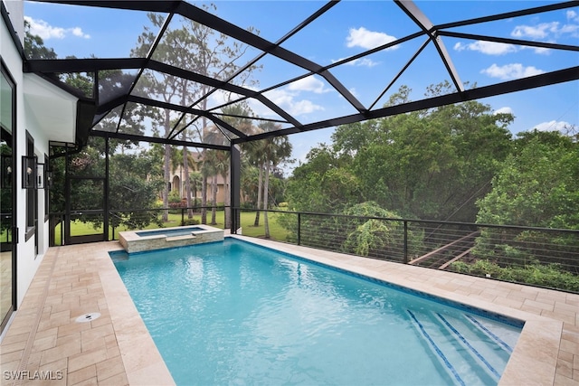 view of swimming pool with a lanai, a patio, and an in ground hot tub