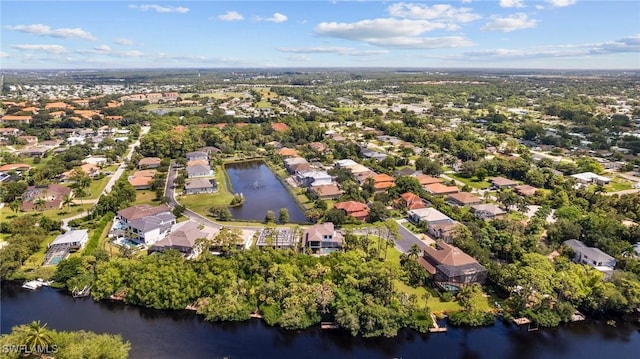 birds eye view of property featuring a water view and a residential view