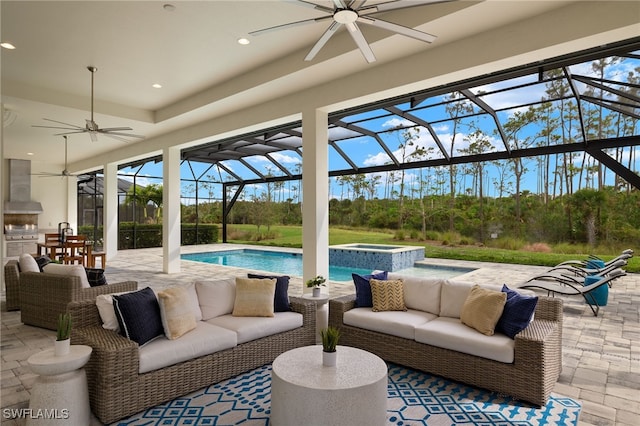 view of patio / terrace featuring ceiling fan, a lanai, outdoor lounge area, and a swimming pool with hot tub