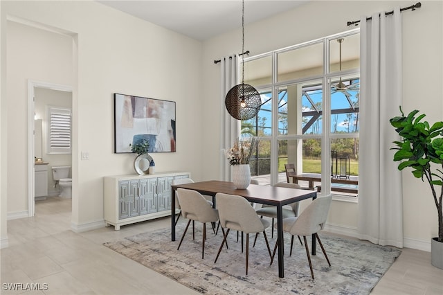 dining space featuring ceiling fan