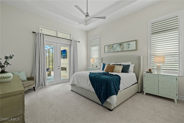 carpeted bedroom featuring access to outside, french doors, and ceiling fan