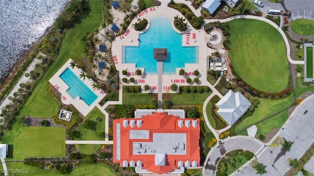 birds eye view of property with a water view