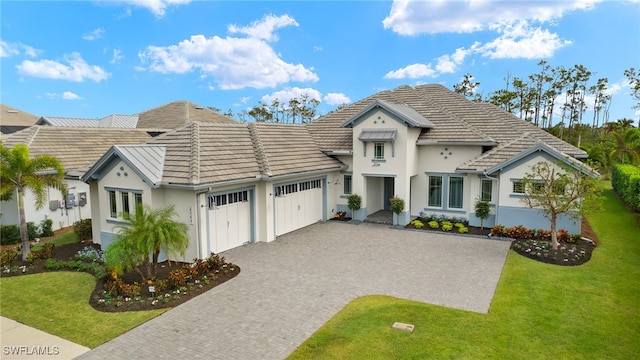 view of front facade with a front lawn and a garage