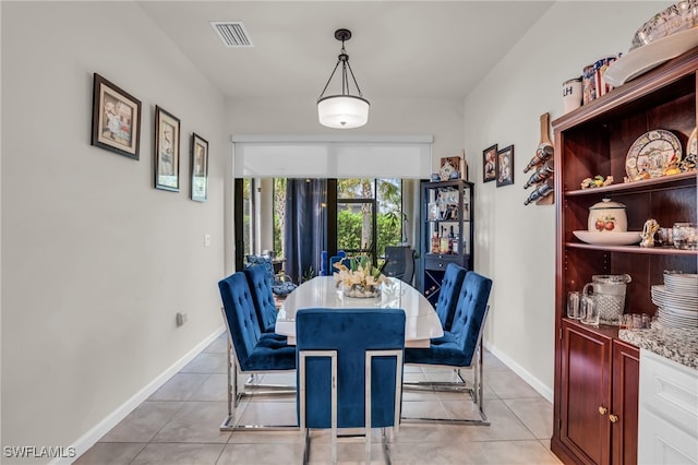 dining room featuring light tile patterned flooring