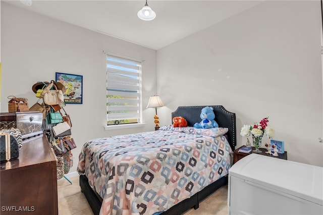 bedroom featuring light tile patterned floors