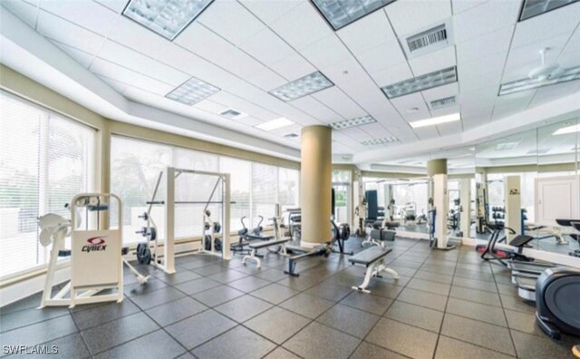 exercise room featuring a drop ceiling