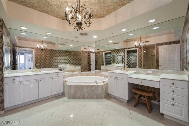 bathroom featuring vanity, tile patterned floors, and separate shower and tub