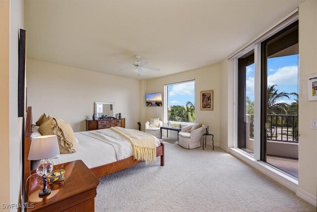 carpeted bedroom with access to exterior and ceiling fan