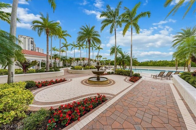 view of property's community with a patio and a pool