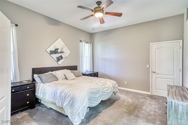 bedroom with ceiling fan and carpet