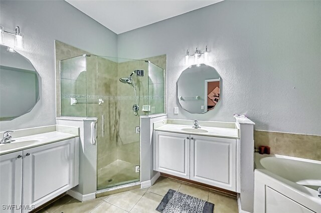 bathroom featuring vanity, tile patterned floors, and shower with separate bathtub