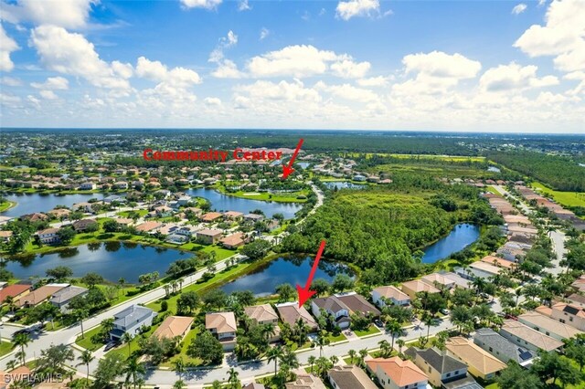 bird's eye view featuring a water view and a residential view