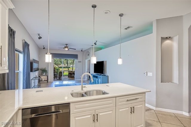 kitchen featuring stainless steel dishwasher, white cabinets, ceiling fan, and sink