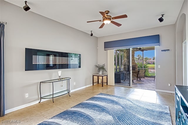 bedroom with access to exterior, ceiling fan, and light tile patterned flooring