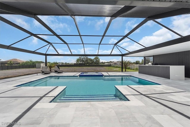 view of pool with a lanai and a patio area