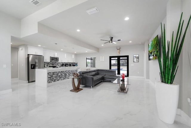 living room featuring ceiling fan