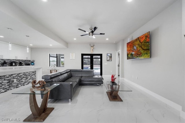 living room with ceiling fan and french doors