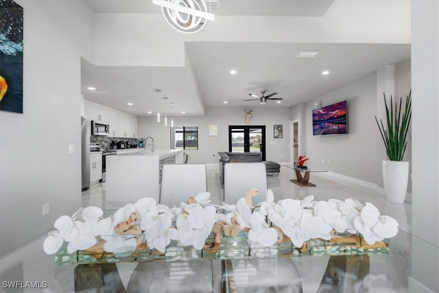 interior space with ceiling fan and sink