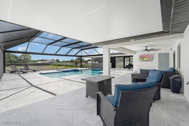 view of pool featuring outdoor lounge area, a lanai, ceiling fan, and a patio area