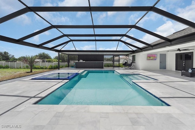 view of pool with a lanai, a patio area, and ceiling fan