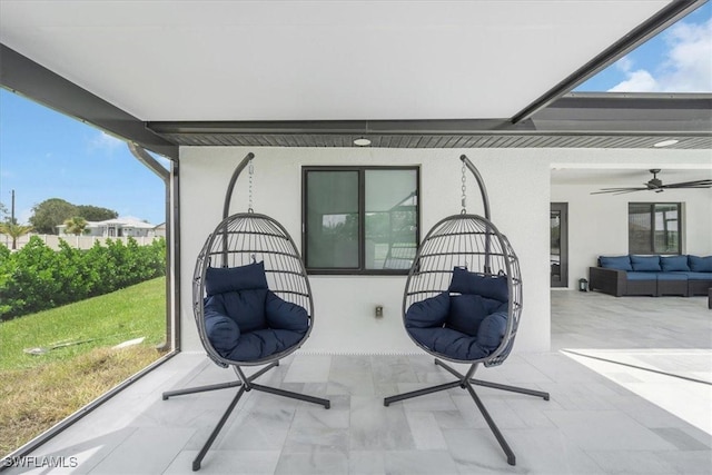 view of patio with outdoor lounge area and ceiling fan