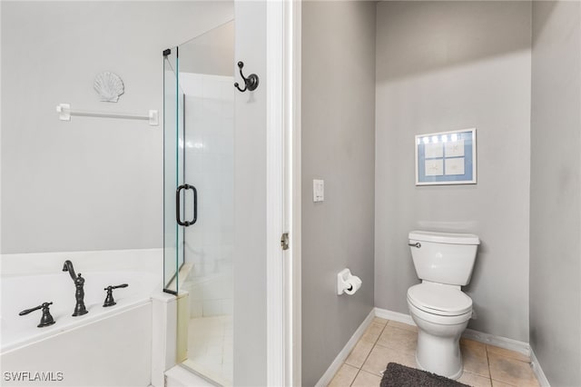 bathroom featuring tile patterned flooring, independent shower and bath, and toilet