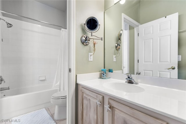 full bathroom with tile patterned flooring, vanity, toilet, and shower / bath combo with shower curtain