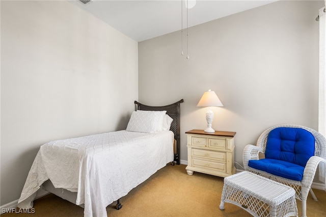 bedroom featuring light colored carpet