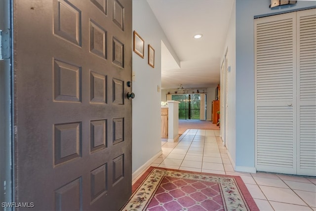 corridor with light tile patterned flooring