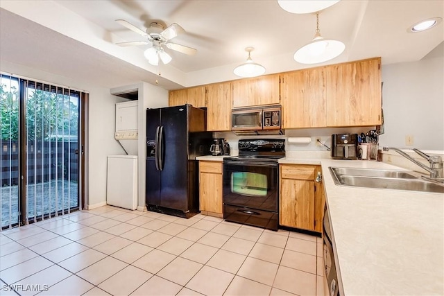 137 Pinebrook Dr, Fort Myers, FL 33907 - kitchen with ceiling fan, a sink, light countertops, black appliances, and stacked washer and clothes dryer